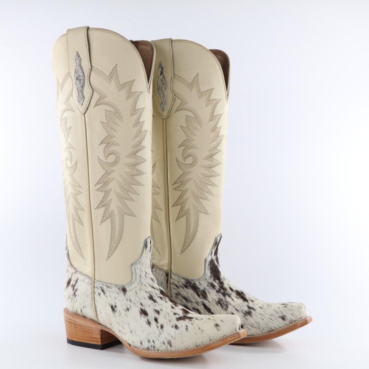 Pair of OAK tall western boots with cream embroidered shafts and hair-on cowhide vamps